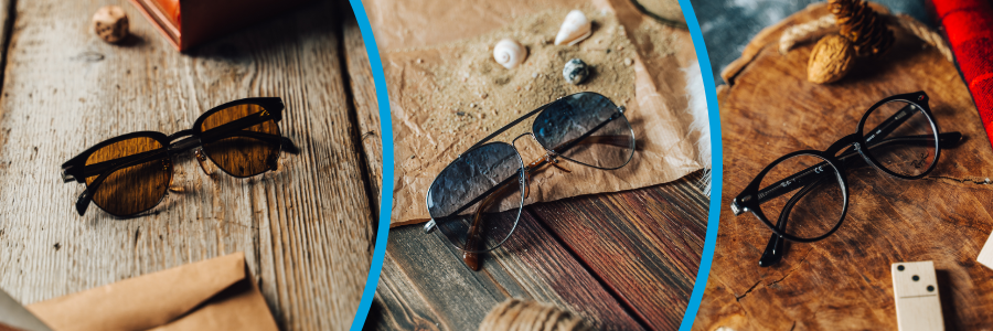 two sunglasses and one pair of glasses on table