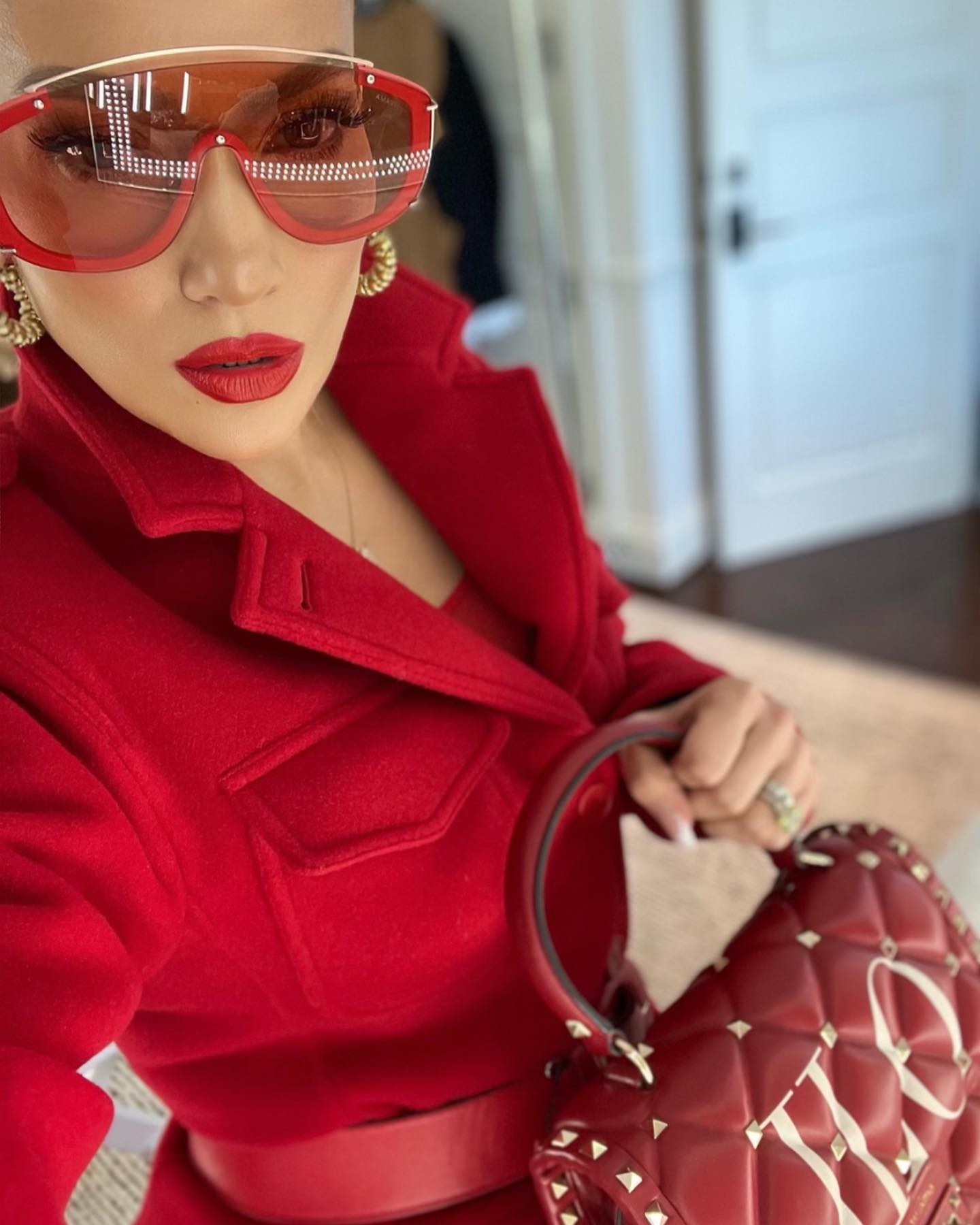 Jennifer Lopez Pairs a Sporty Look with Oversized Versace Shades